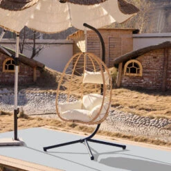 Hangstoel Van Bruin Rotan En Metaal -Meubelpromotie 5365920026cb4a32997f00887511844a